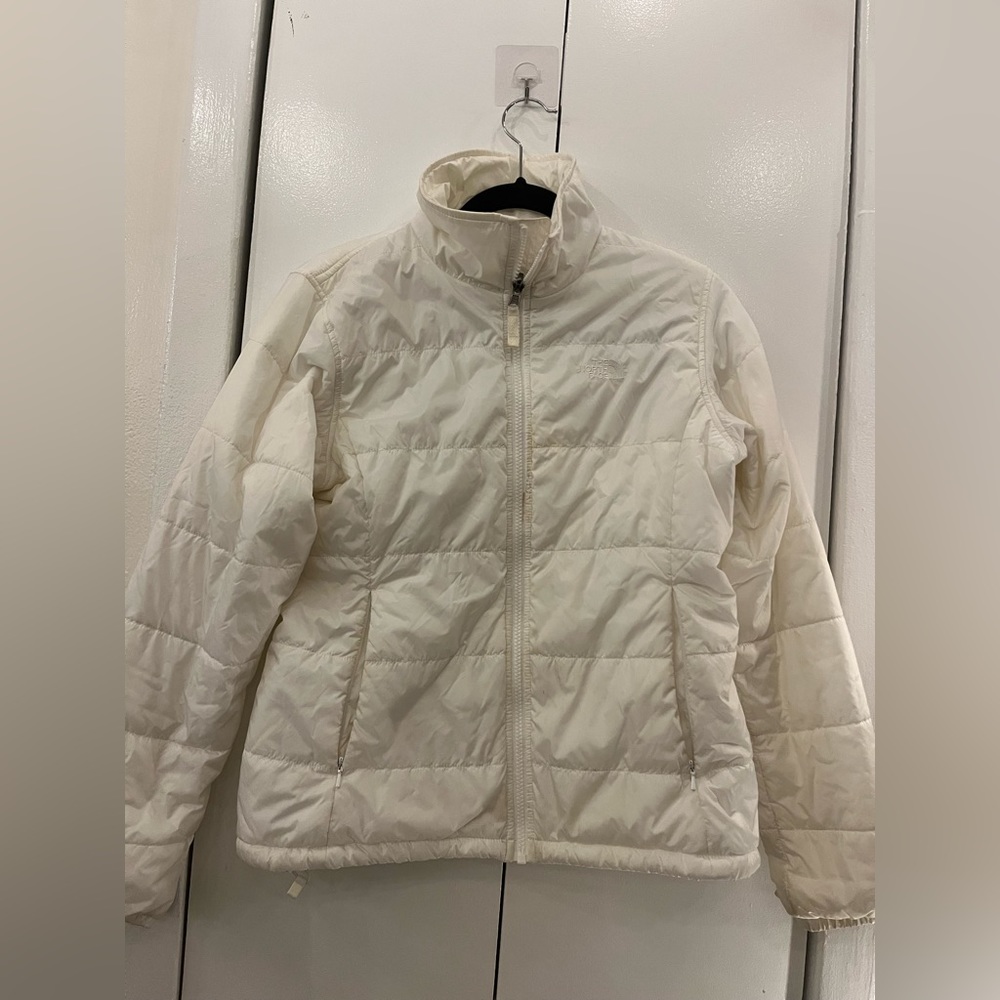 The North Face women’s white zip up puffer jacket